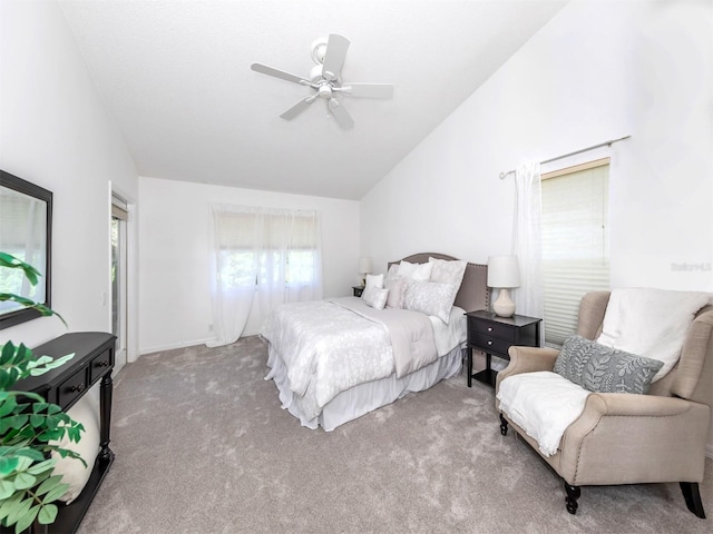 carpeted bedroom with ceiling fan and lofted ceiling