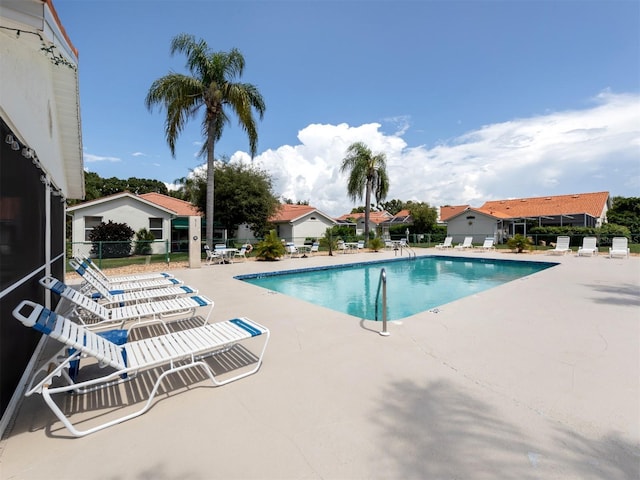 view of swimming pool with a patio