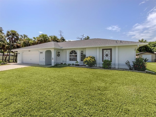 ranch-style house featuring a front yard and a garage