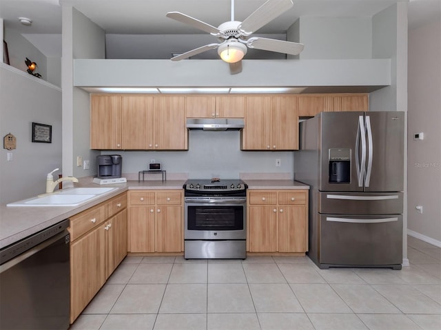 kitchen featuring ceiling fan, light tile patterned floors, sink, stainless steel appliances, and light brown cabinetry