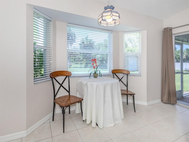 dining room with plenty of natural light and light tile patterned floors