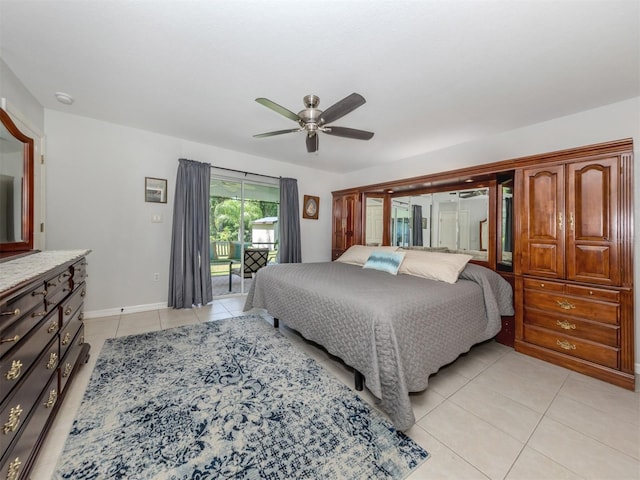 tiled bedroom featuring ceiling fan and access to exterior