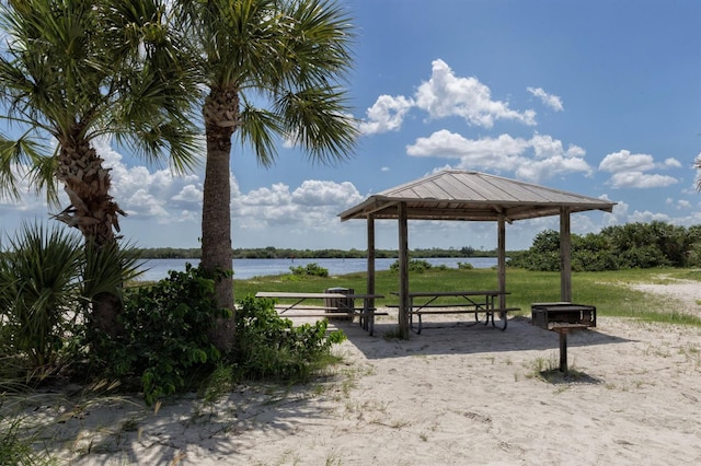 view of home's community with a water view and a gazebo