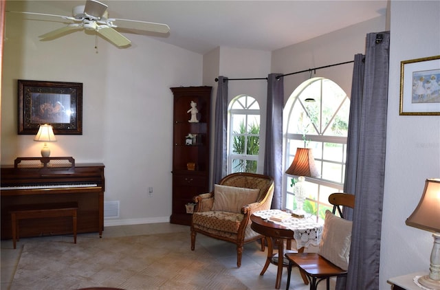 sitting room with ceiling fan