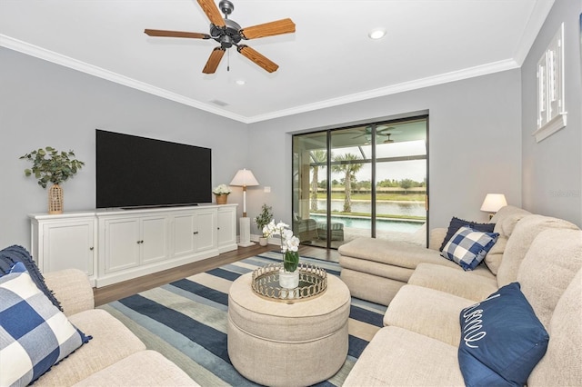 living room featuring wood-type flooring and crown molding