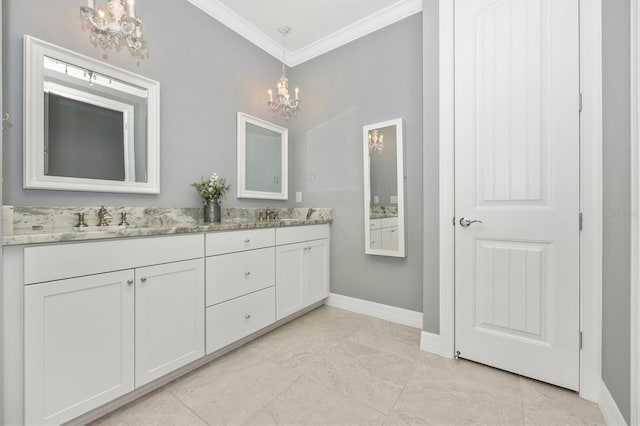 bathroom with vanity, crown molding, and an inviting chandelier