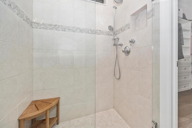 bathroom with a tile shower