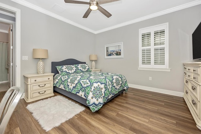 bedroom with hardwood / wood-style floors, ceiling fan, and crown molding