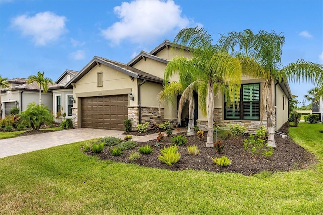 view of front of property featuring a garage and a front lawn