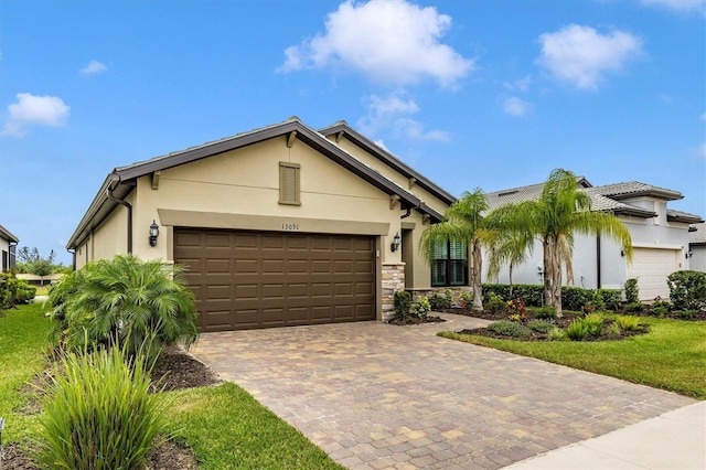 view of front facade with a garage and a front lawn