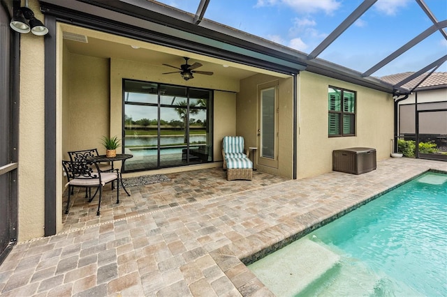 exterior space with a patio, ceiling fan, and a lanai