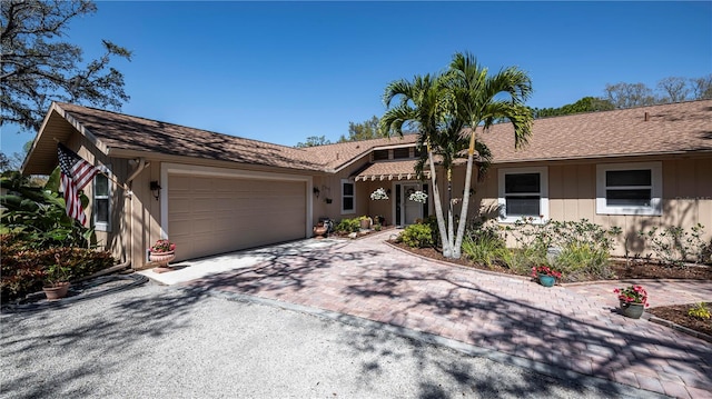 single story home featuring a garage