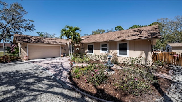 single story home with a garage