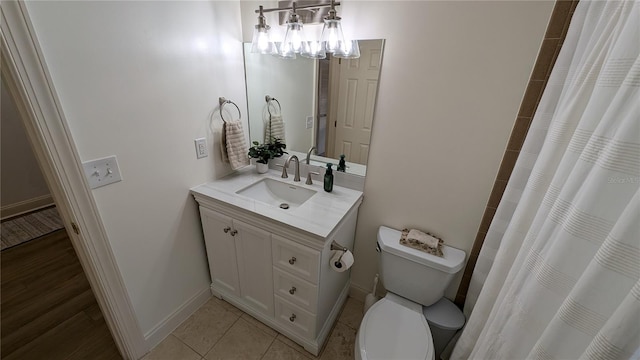 bathroom featuring vanity, toilet, curtained shower, and tile patterned floors