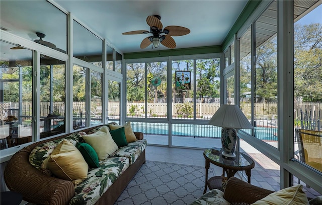 sunroom / solarium with ceiling fan