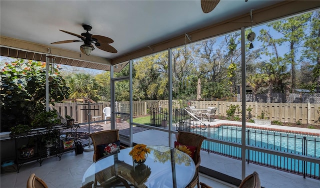 sunroom / solarium with ceiling fan