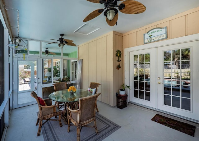 sunroom / solarium with ceiling fan and french doors