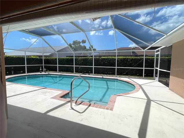 view of pool featuring a patio area and a lanai