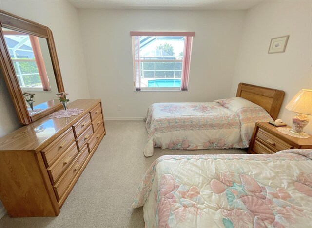 bedroom featuring baseboards and carpet floors