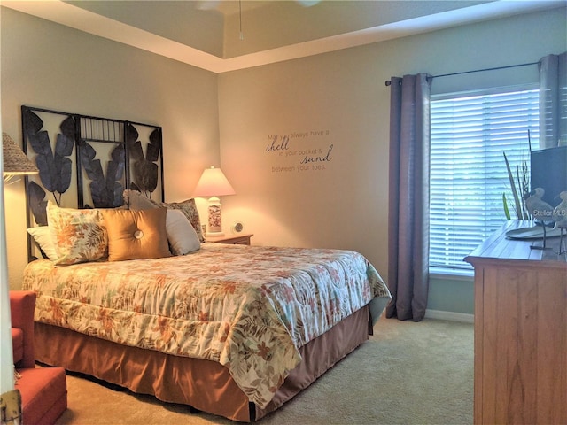 bedroom featuring multiple windows and light colored carpet