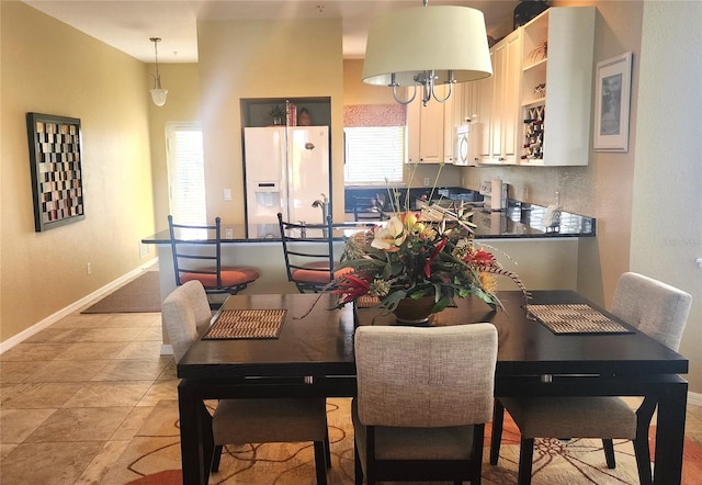 dining space featuring baseboards