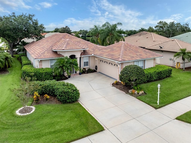 mediterranean / spanish-style home with a garage and a front yard