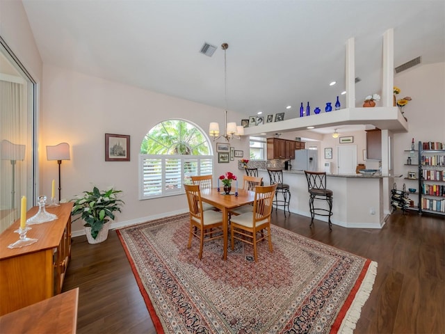 dining area featuring an inviting chandelier and dark hardwood / wood-style floors