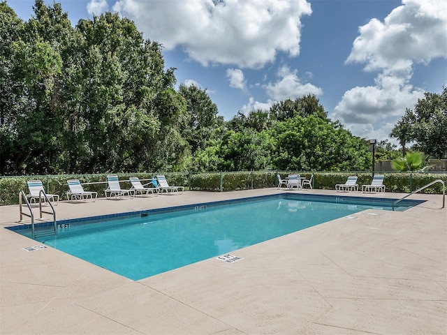 view of pool featuring a patio area