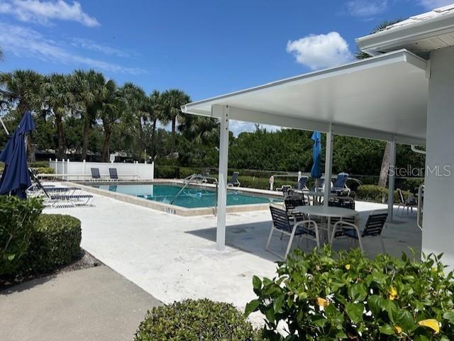 view of swimming pool with a patio area