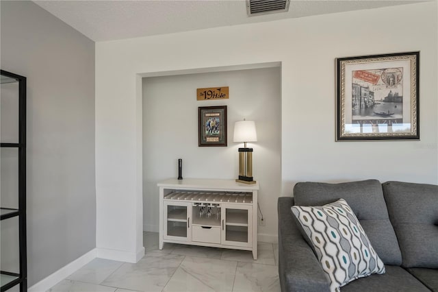 living room with a textured ceiling