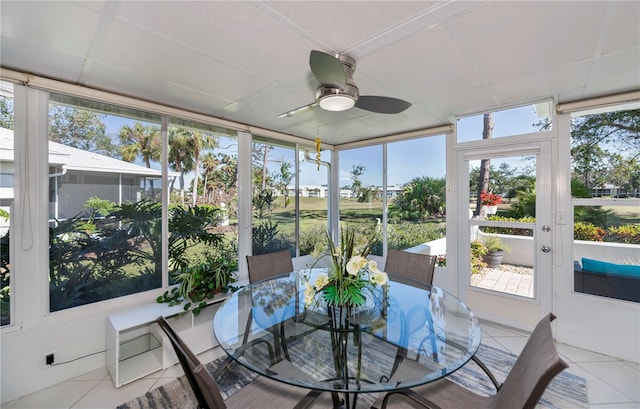 sunroom featuring ceiling fan