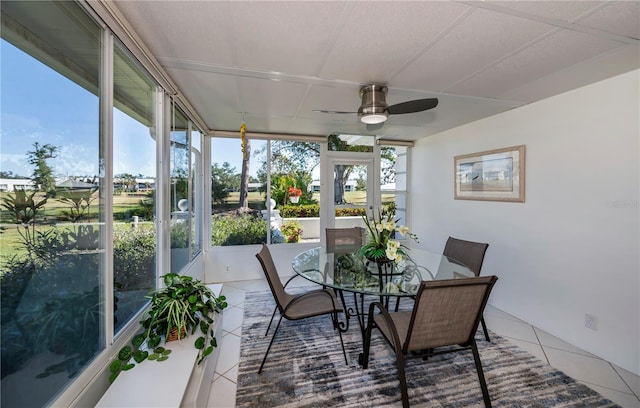 sunroom / solarium featuring ceiling fan and a wealth of natural light