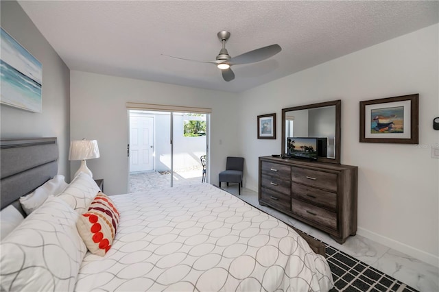 bedroom with access to outside, ceiling fan, and a textured ceiling