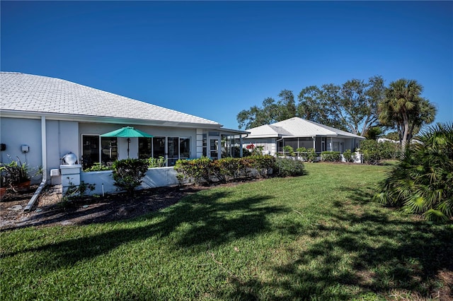 view of yard featuring a sunroom