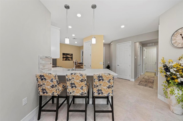 tiled dining area featuring sink