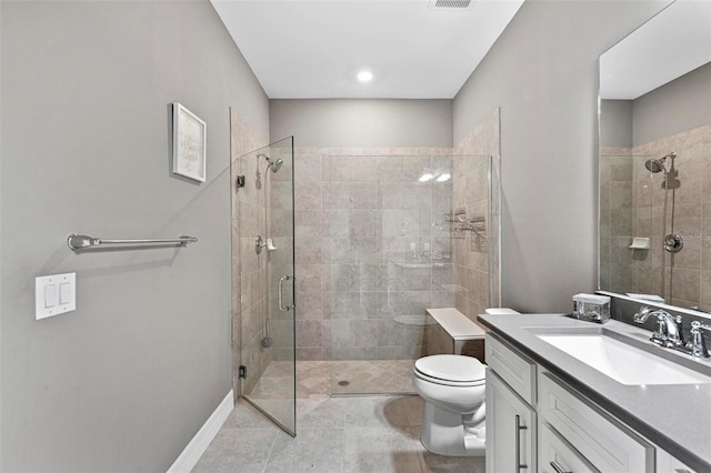 bathroom with tile patterned flooring, vanity, an enclosed shower, and toilet