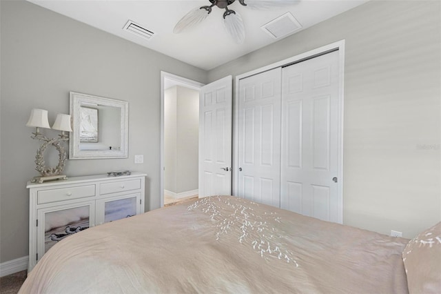 bedroom featuring ceiling fan and a closet