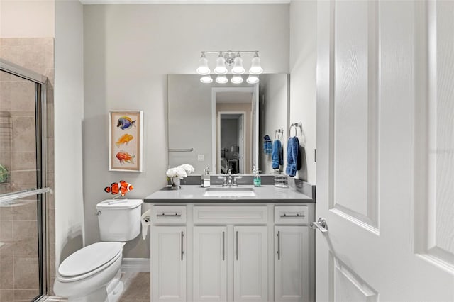 bathroom with vanity, toilet, and walk in shower