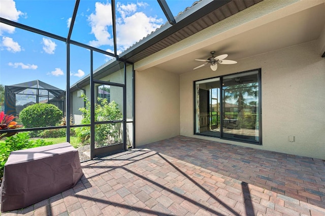 exterior space featuring ceiling fan and a lanai