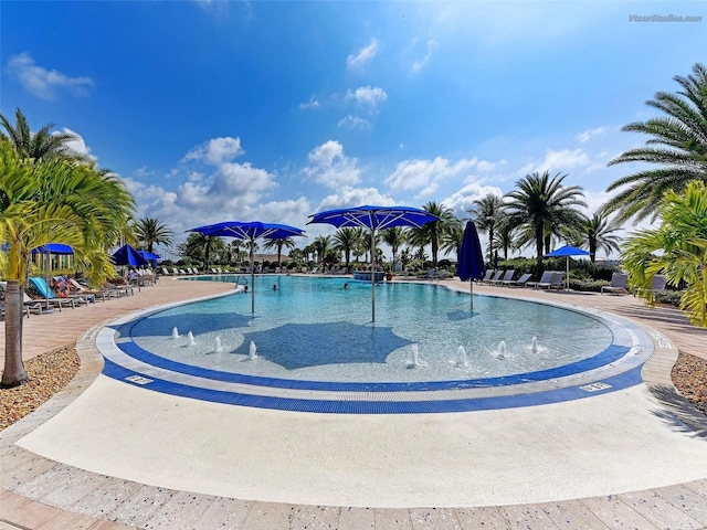 view of swimming pool with pool water feature