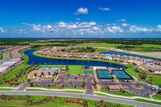 birds eye view of property with a water view