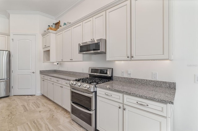 kitchen featuring appliances with stainless steel finishes and crown molding