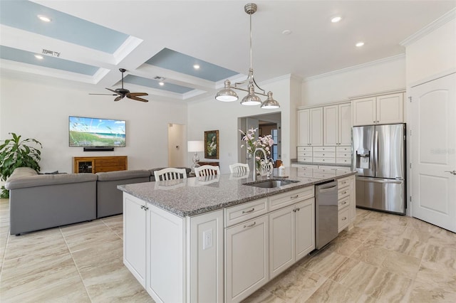 kitchen with visible vents, coffered ceiling, an island with sink, stainless steel appliances, and a sink