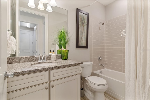 full bathroom featuring shower / tub combo, vanity, and toilet