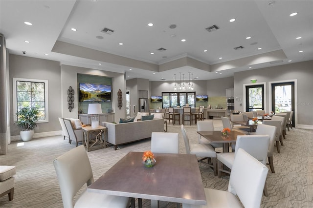 dining room featuring visible vents, a tray ceiling, and recessed lighting