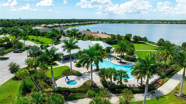 birds eye view of property with a water view