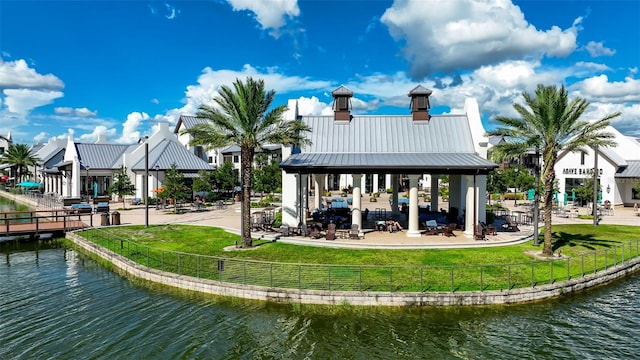 surrounding community featuring a water view, fence, a yard, a gazebo, and a patio area