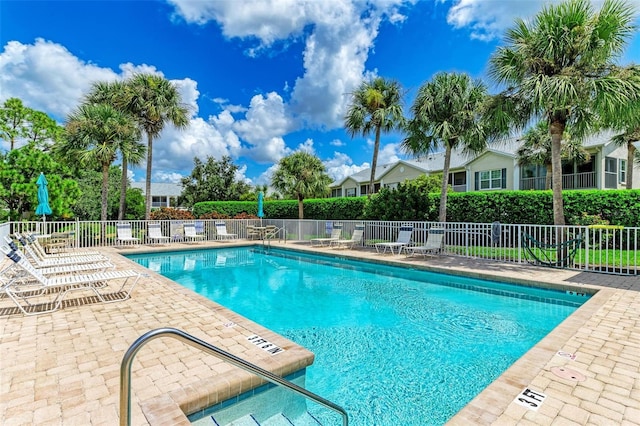 view of swimming pool featuring a patio area