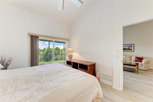 bedroom with high vaulted ceiling, access to exterior, light wood-type flooring, and ceiling fan