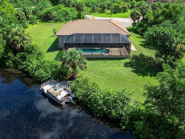 birds eye view of property with a water view